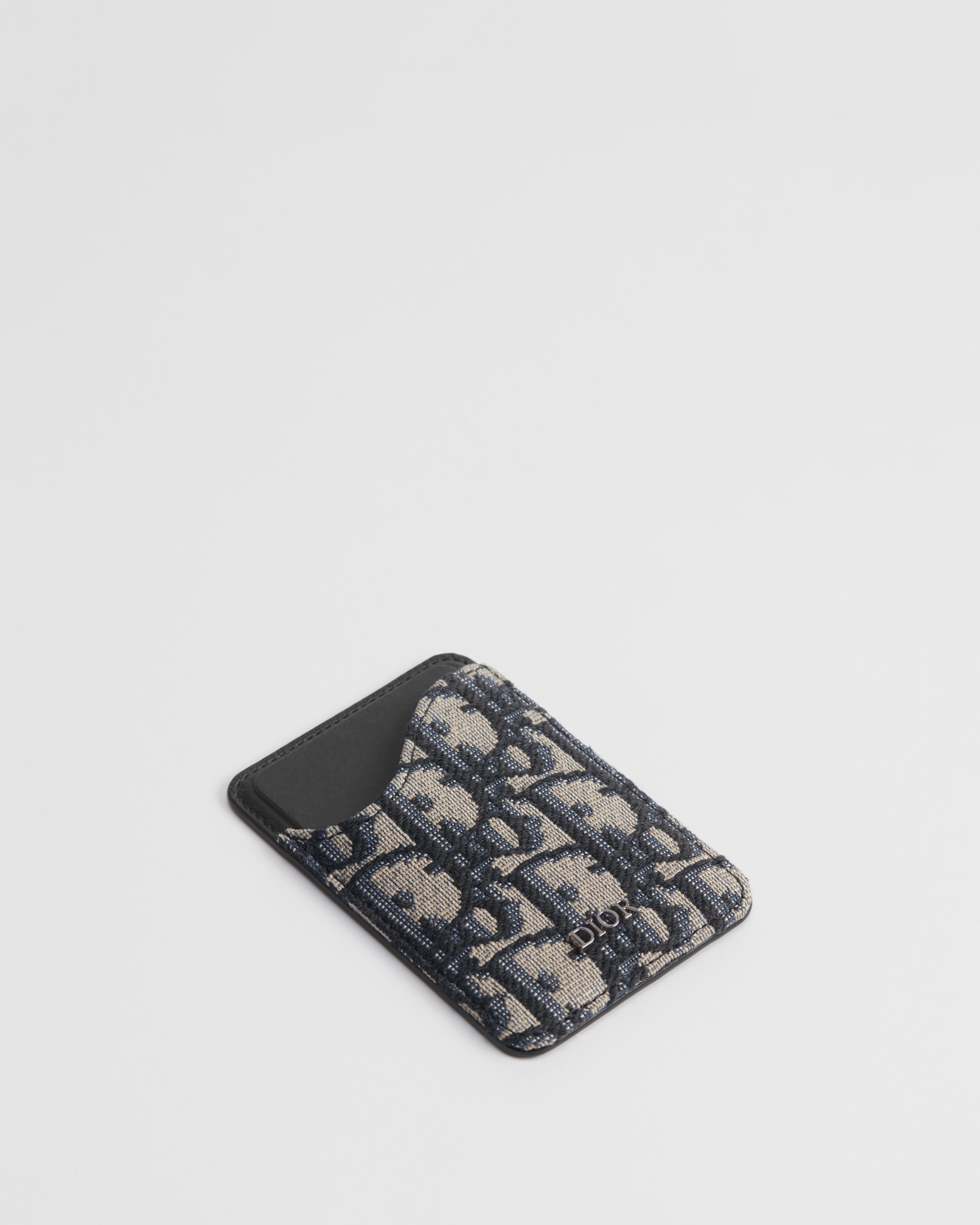 Saddle 磁石卡片套 黑色顆粒小牛皮鑲嵌工藝配米色和黑色 Dior Oblique 圖案緹花 E03