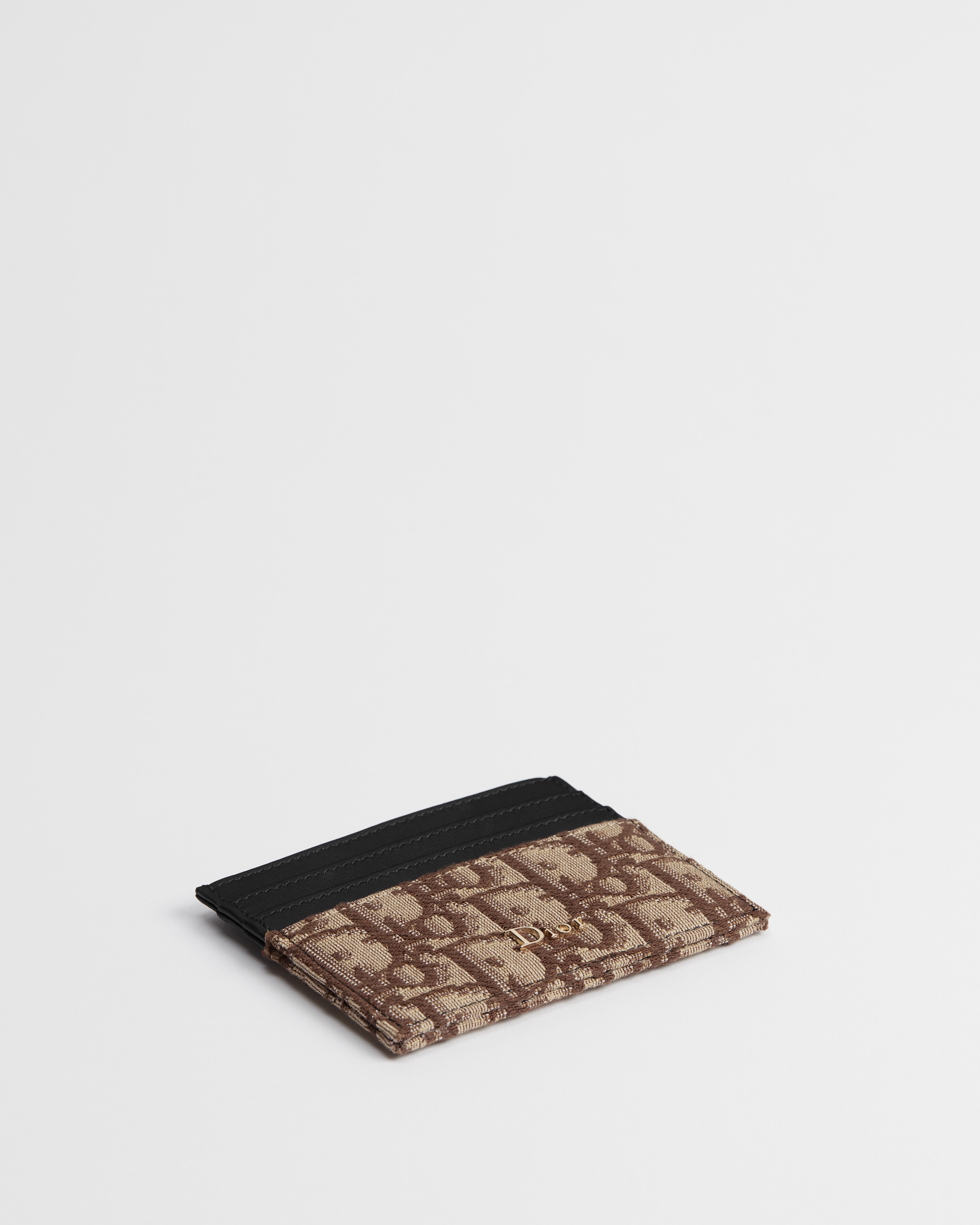 حاملة بطاقات جلد العجل الناعم المطعّم الأسود ونمط ديور أوبليك البني بحبك الجاكار E03