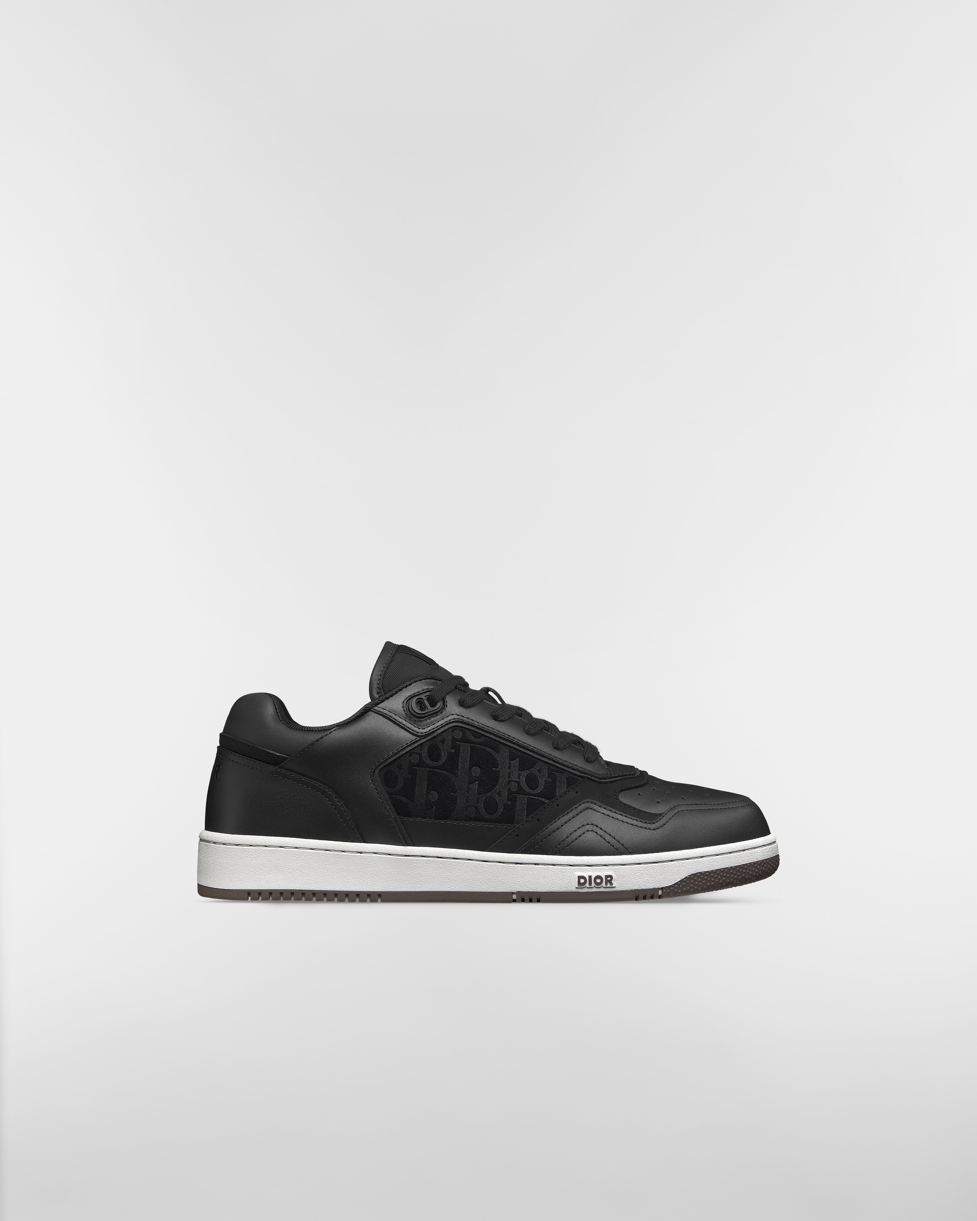 B27 Uptown Low Top Sneaker Glattes Kalbsleder in Schwarz und Veloursleder mit Dior Oblique Prägung in Schwarz E02