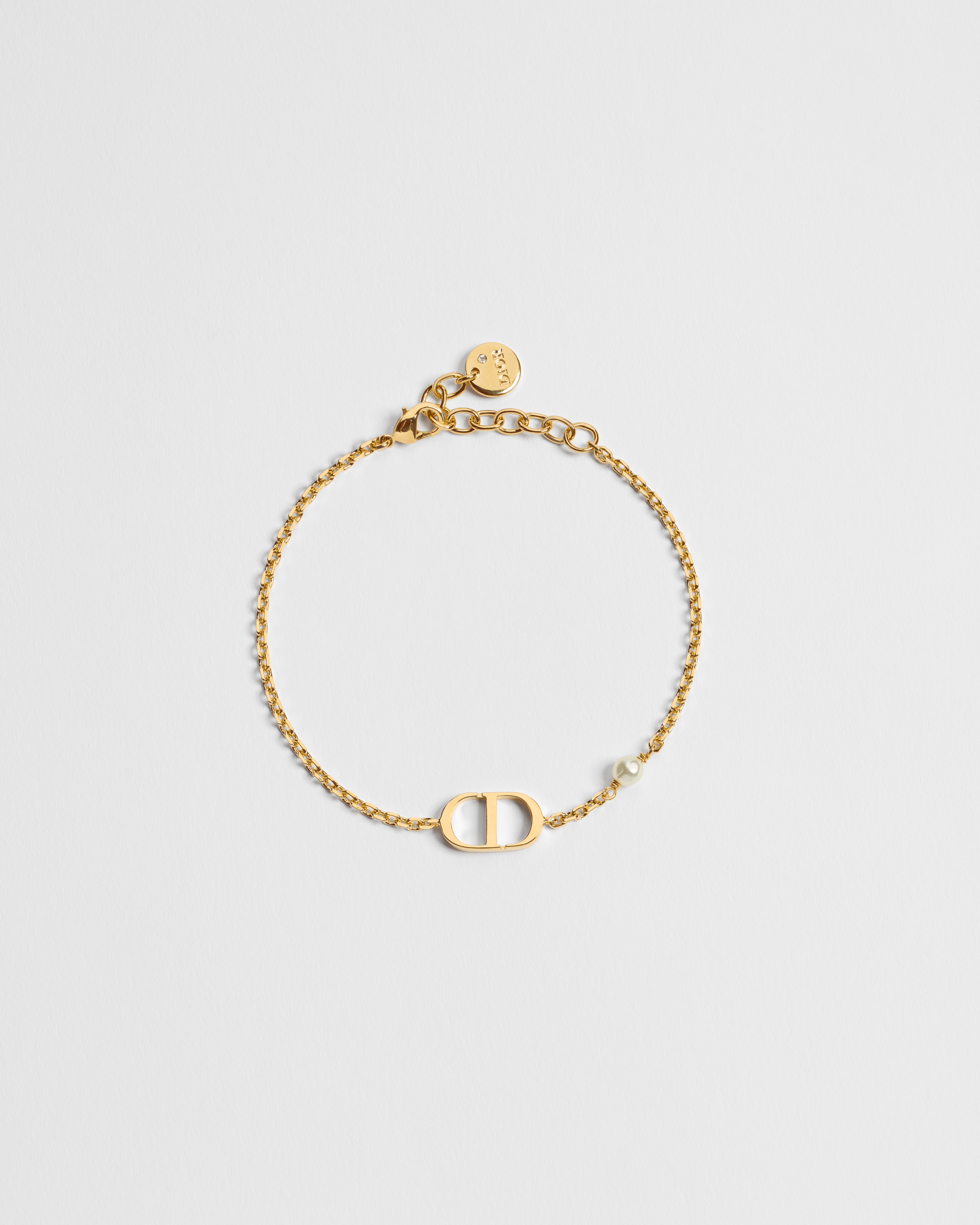 Petit CD Armband Metall mit Gold-Finish und Kunstharzperle in Weiß E01