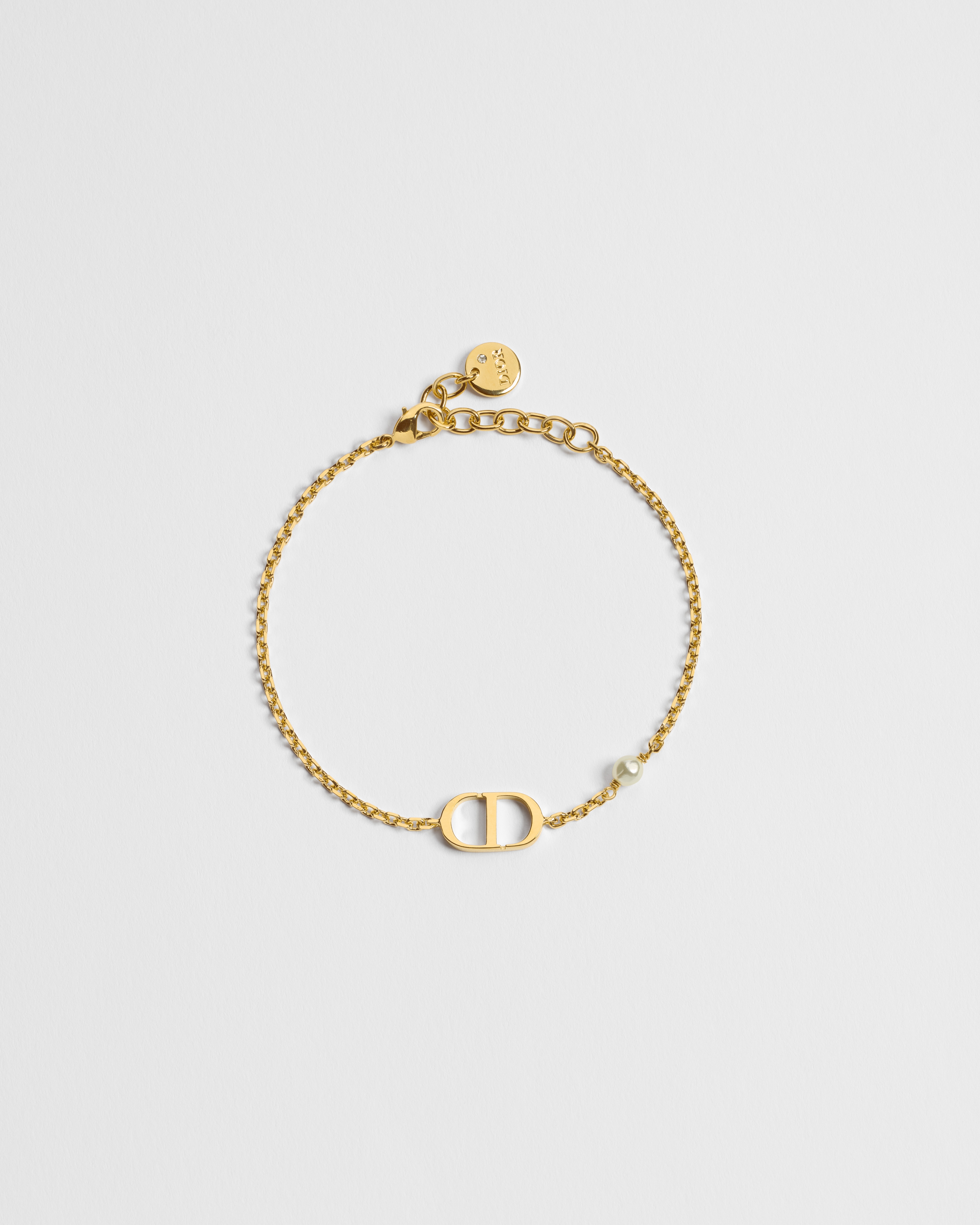 سوار Petit CD معدن ذهبي ولؤلؤة من الراتنج الأبيض E01