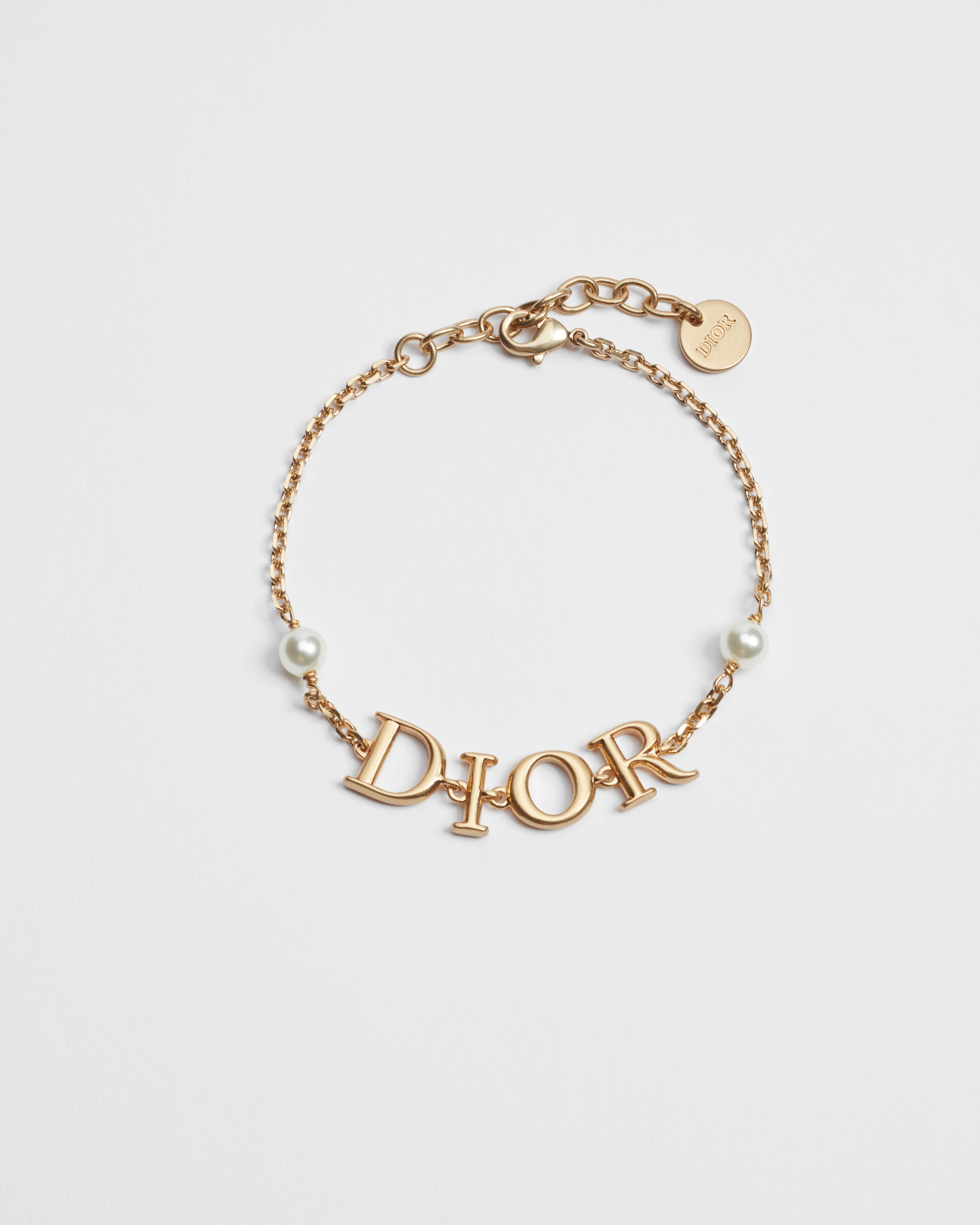 Bracciale Dio(r)evolution Metallo con finitura color oro e perle in resina bianca E01