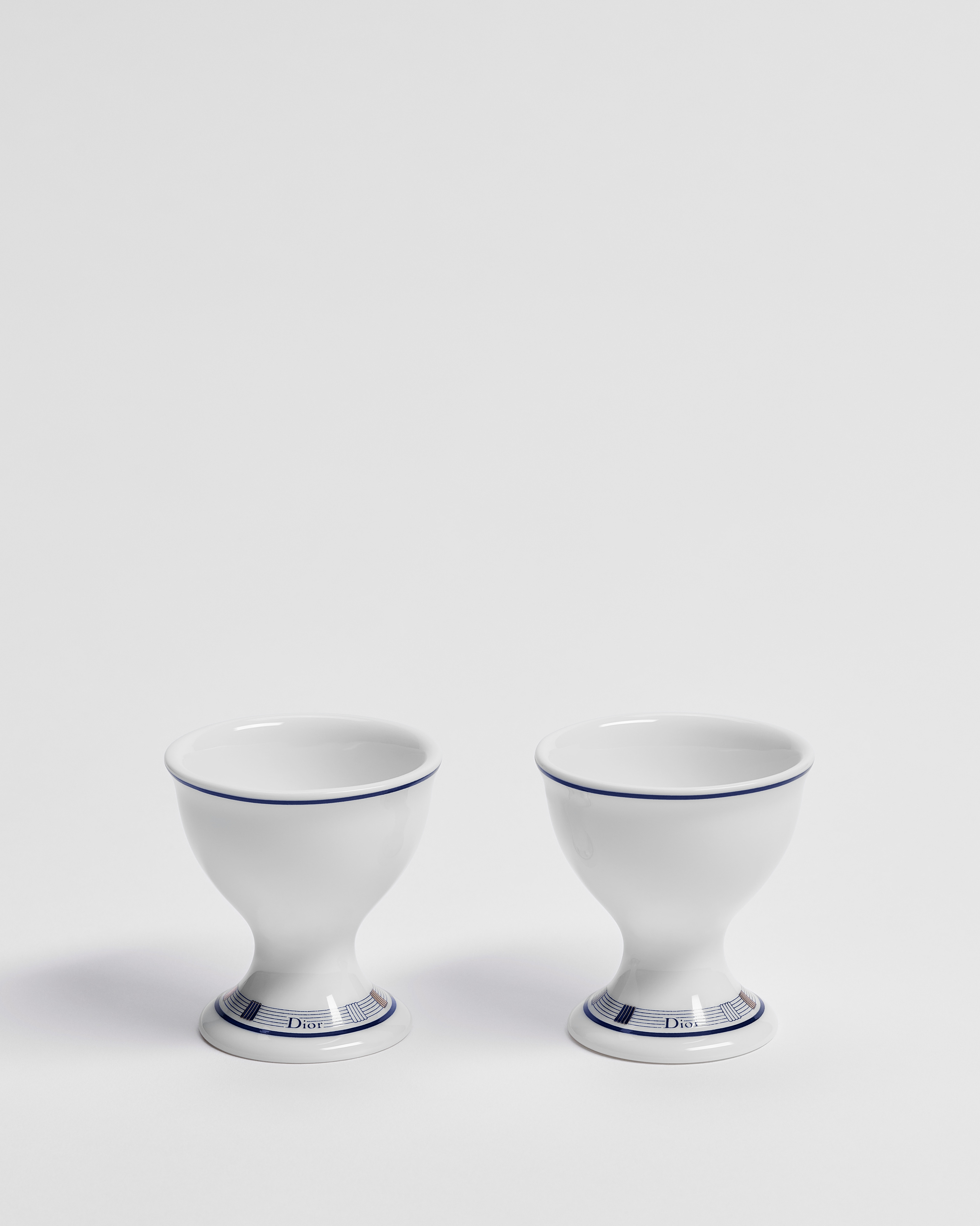 Set van twee eierdopjes Wit Limoges-porselein met blauw Godron-motief E02