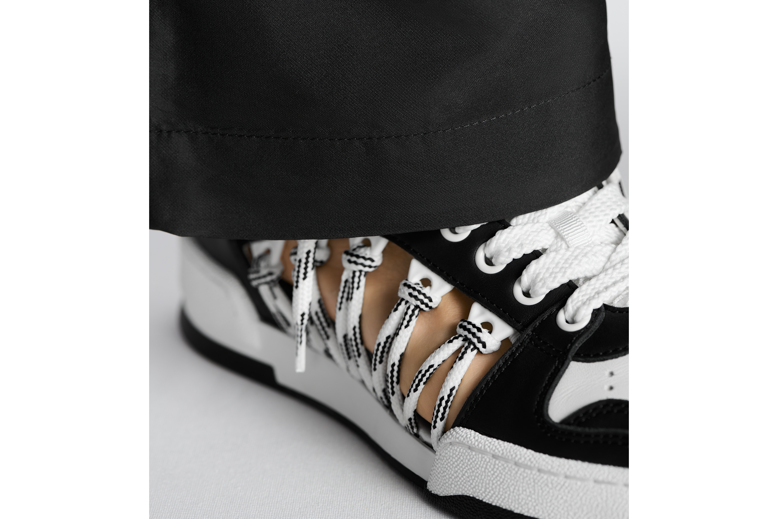 Look Dior First High-Top Sneaker Black and White Calfskin with Two-Tone Laces E15