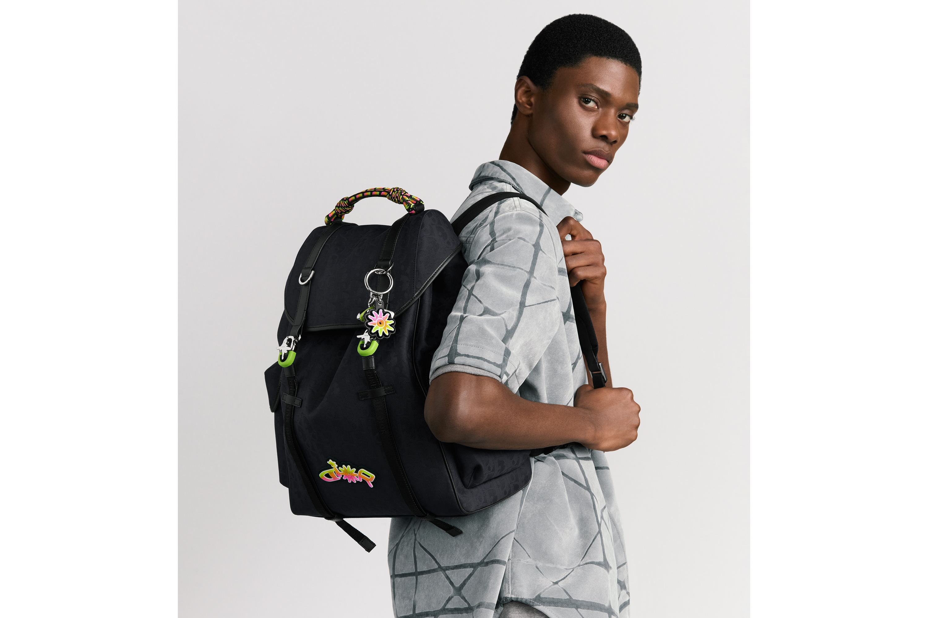 Look DIOR AND LEWIS HAMILTON Dior Hit the Road Backpack with Flap Black Dior Oblique Nylon and Black Leather-Effect Technical Fabric E19