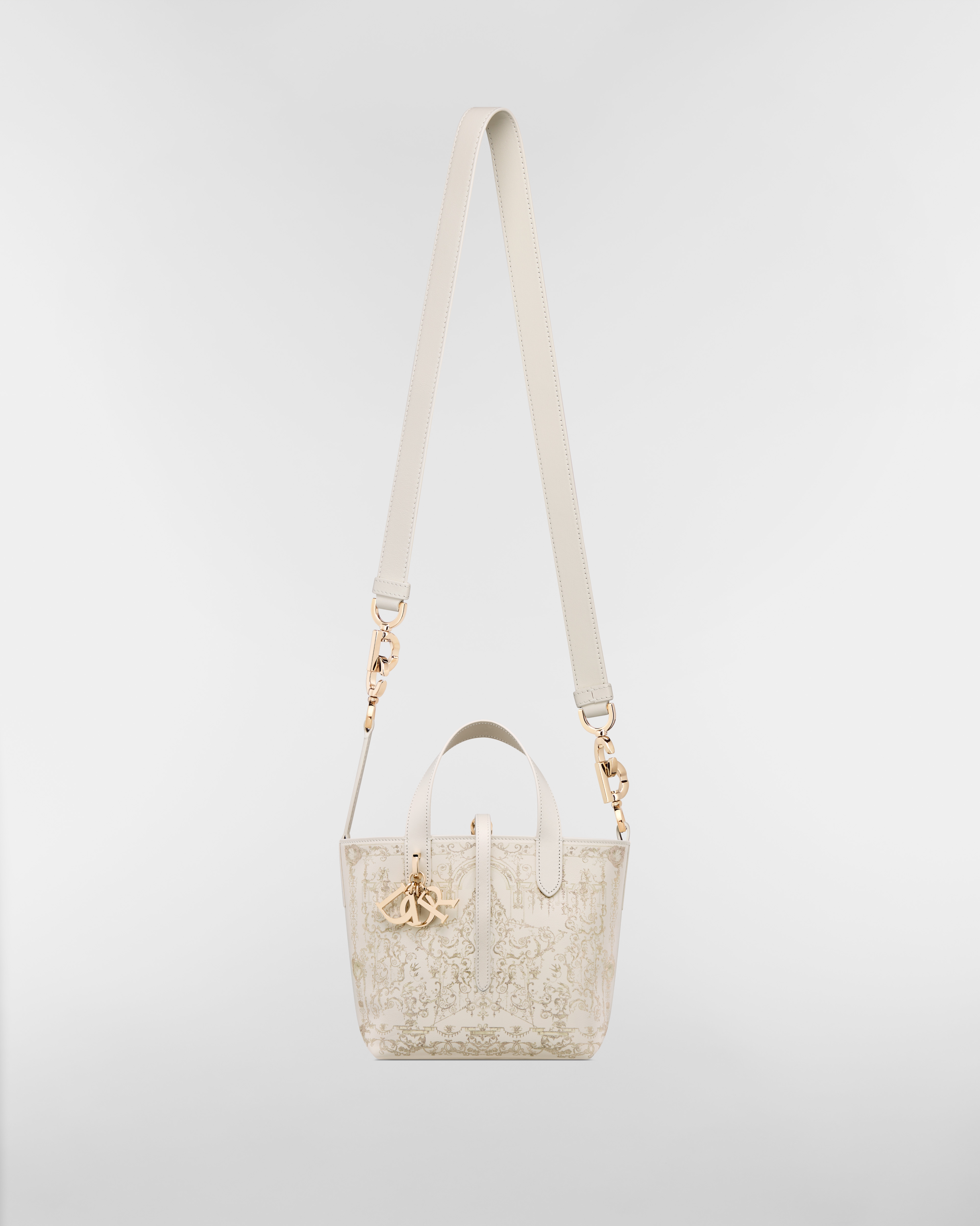 Bolsa tote vertical Dior Toujours pequena Couro de vitelo latte com estampa Dioresque Stella dourada E07