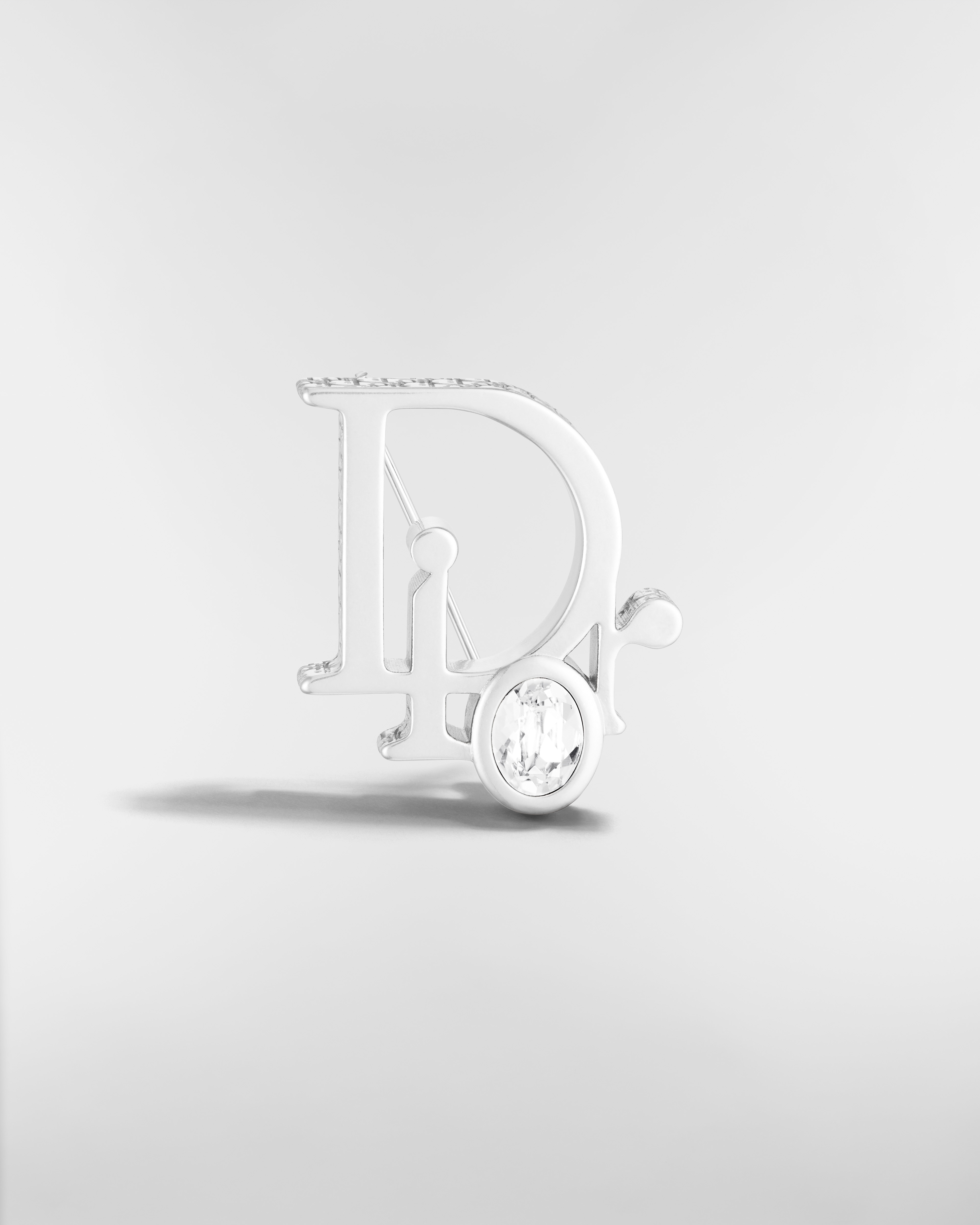 Broche Dior Sparkle Laiton argenté, cristal blanc et résine grise E01